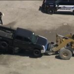 Witnesses Stunned After Truck Lands on Top of Another at Billerica Auto Auction